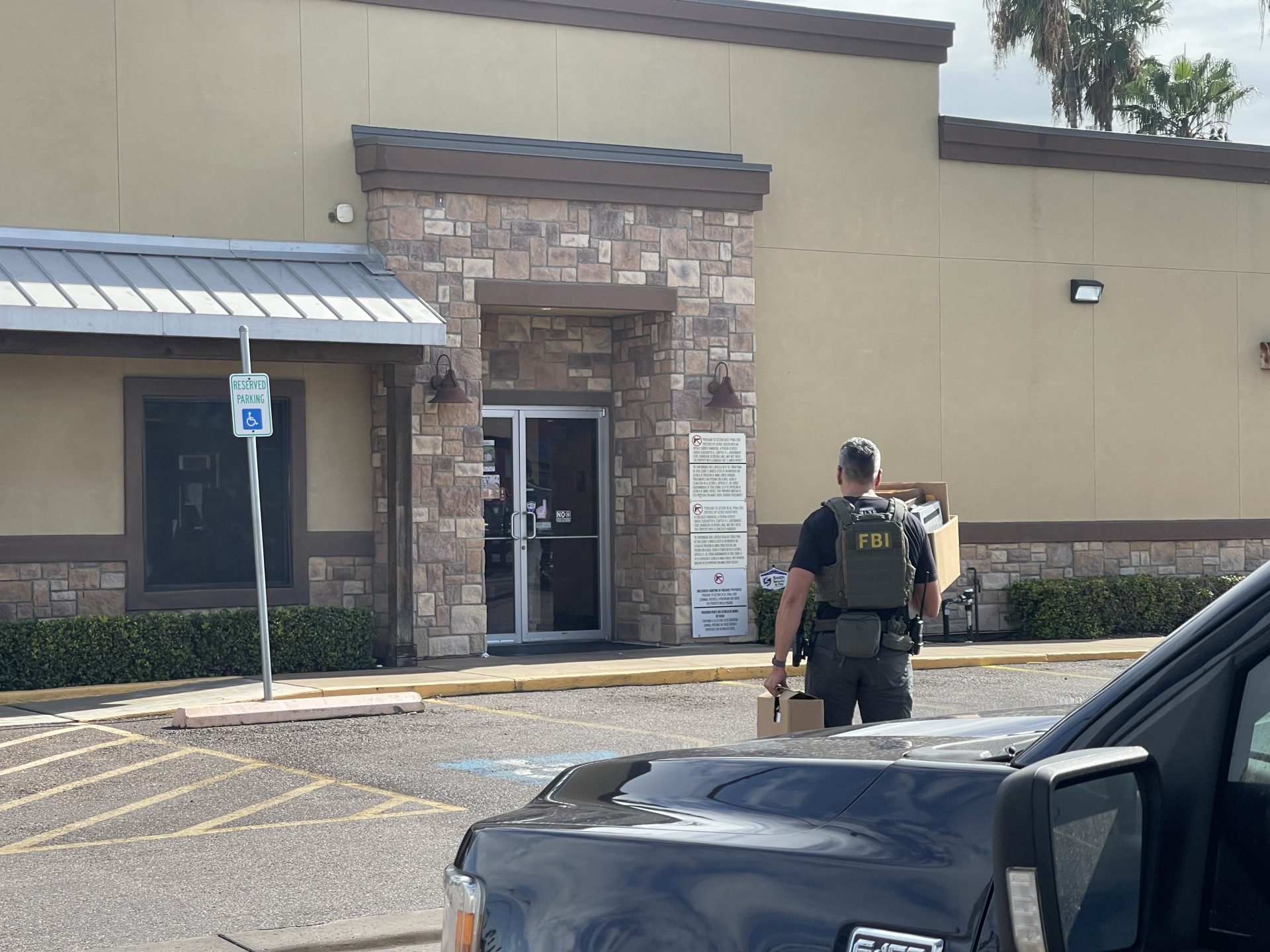 Federal agents at Delia’s Tamales in McAllen